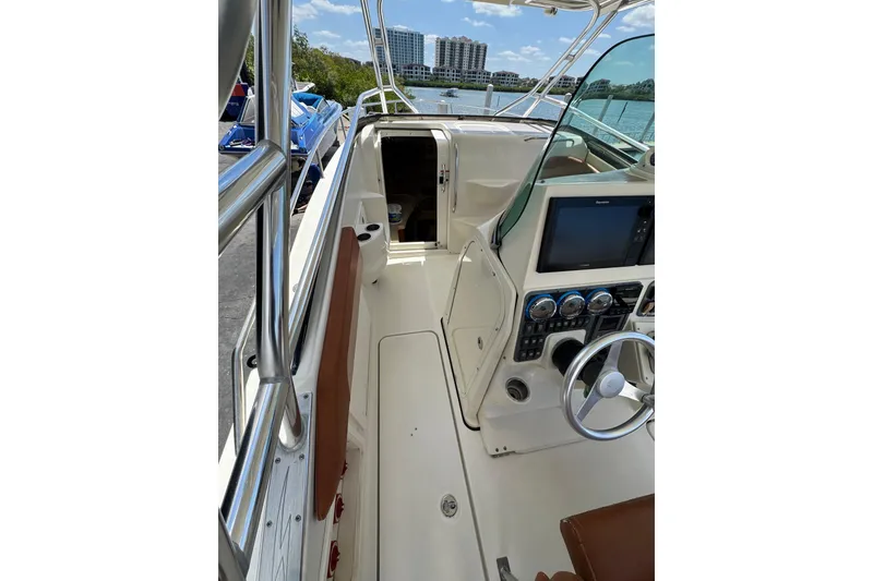 Slide: The Image of 2006 Hydra-Sports Vector 3300 VX boat interior with steering console and navigation equipment. - 19