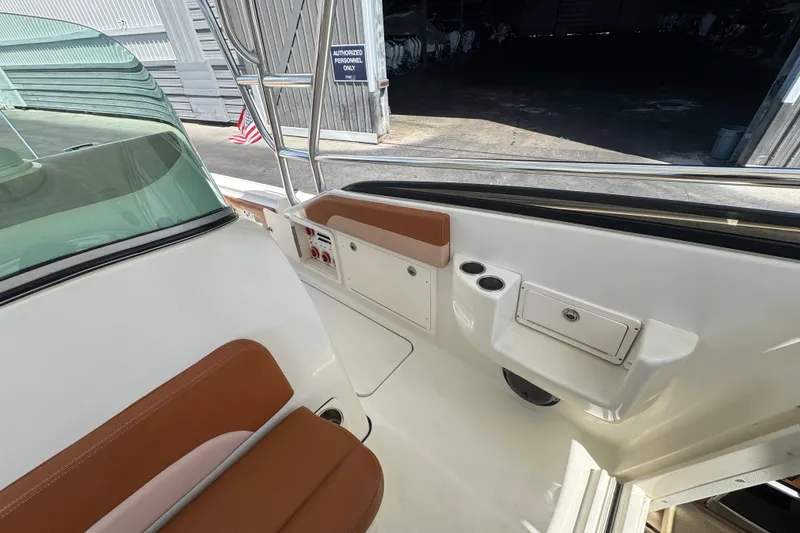 Slide: The Image of 2006 Hydra-Sports Vector 3300 VX boat interior with seating and storage compartments. - 22