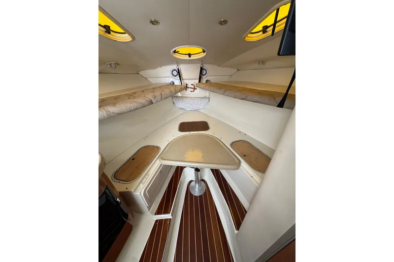 Slide: The Image of 2006 Hydra-Sports Vector 3300 VX cabin interior with seating and table. - 24