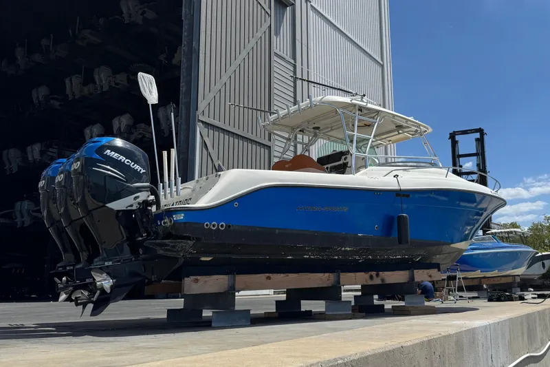 Slide: The Image of 2006 Hydra-Sports Vector 3300 VX boat in shipyard with Mercury engines. - 3