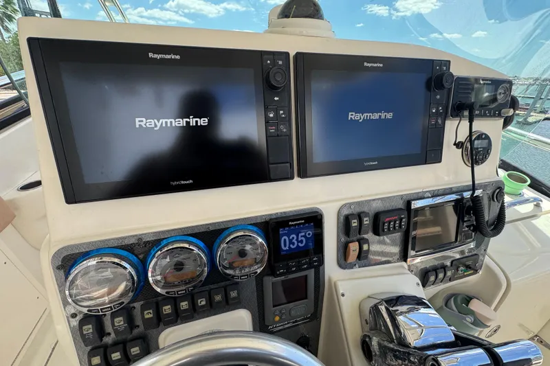 Slide: The Image of Control panel of a 2006 Hydra-Sports Vector 3300 VX with Raymarine displays. - 37