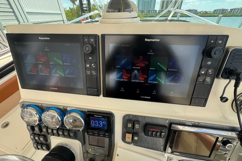 Slide: The Image of Control panel of a 2006 Hydra-Sports Vector 3300 VX with Raymarine displays. - 39
