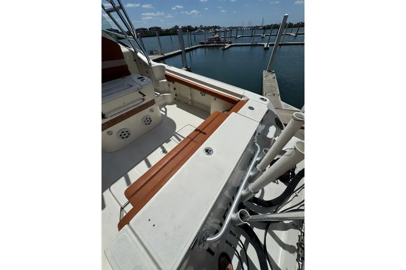 Slide: The Image of 2006 Hydra-Sports Vector 3300 VX boat interior with seating, docked by the water. - 42
