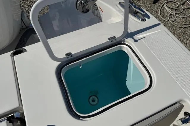 Slide: The Image of Open storage compartment on 2026 Pursuit S 328 Sport boat. - 12