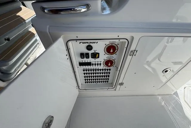 Slide: The Image of Control panel of 2026 Pursuit S 328 Sport boat with switches and dials. - 18