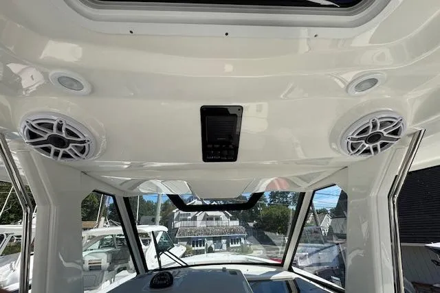 Slide: The Image of 2026 Pursuit S 328 Sport boat interior with speakers and sunroof. - 21