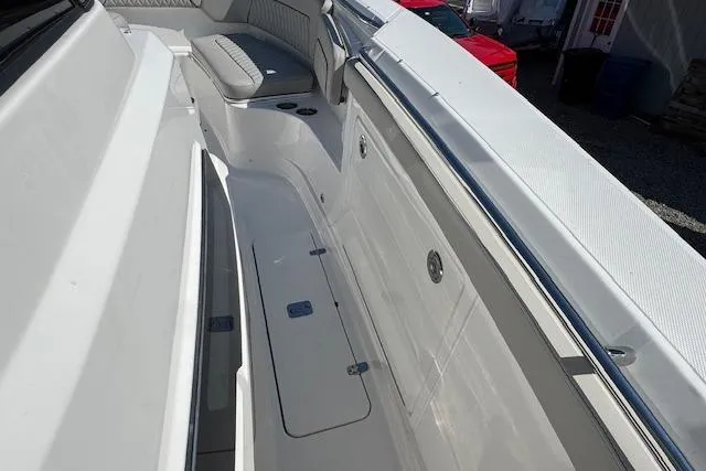 Slide: The Image of 2026 Pursuit S 328 Sport boat interior with seating and storage compartments. - 23