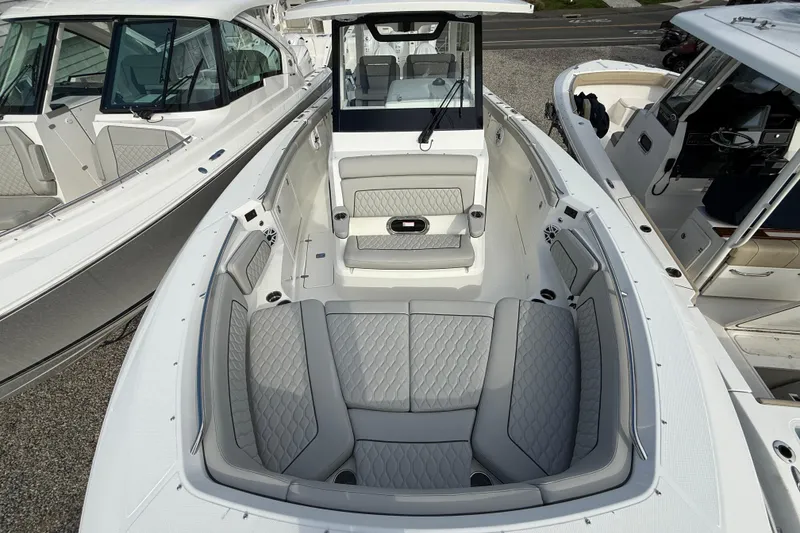 Slide: The Image of 2026 Pursuit S 328 Sport boat interior with luxurious seating and modern design. - 28