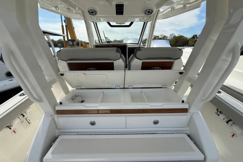 Slide: The Image of 2026 Pursuit S 328 Sport boat interior with seating and storage compartments. - 32