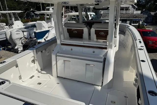 Slide: The Image of 2026 Pursuit S 328 Sport boat interior with seating and storage compartments. - 9