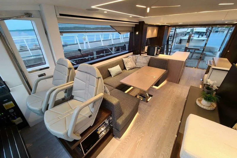 Slide: The Image of Luxurious interior of 2023 Sunseeker Manhattan 68 yacht with modern seating and elegant decor. - 15