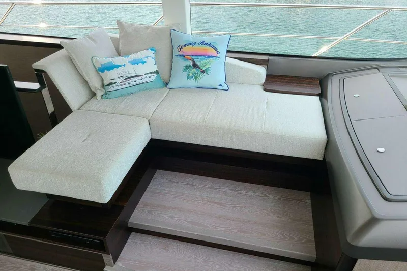 Slide: The Image of Luxurious seating area on 2023 Sunseeker Manhattan 68 yacht with decorative pillows. - 16