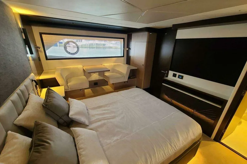 Slide: The Image of Luxurious interior of 2023 Sunseeker Manhattan 68 yacht, featuring elegant bedroom and seating area. - 22