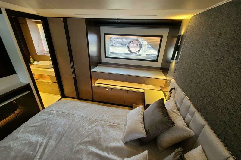 Slide: The Image of Luxurious bedroom interior of 2023 Sunseeker Manhattan 68 yacht, featuring modern design and elegant furnishings. - 23