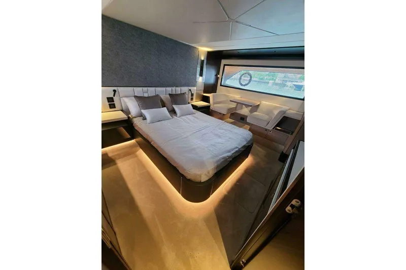 Slide: The Image of Luxurious bedroom interior of 2023 Sunseeker Manhattan 68 yacht, featuring modern design and ambient lighting. - 26