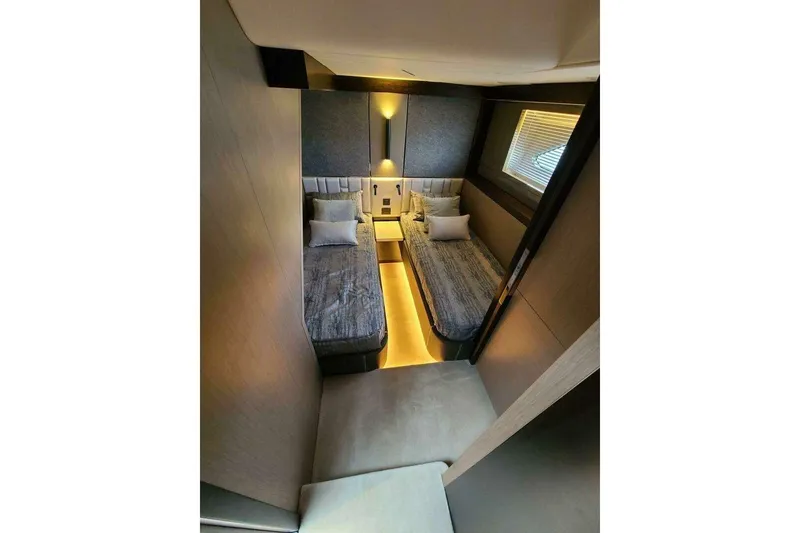 Slide: The Image of Luxurious twin bedroom in 2023 Sunseeker Manhattan 68 yacht, featuring modern design and ambient lighting. - 31