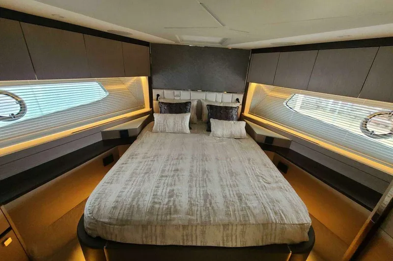 Slide: The Image of Luxurious bedroom interior of 2023 Sunseeker Manhattan 68 yacht, featuring elegant design and ambient lighting. - 33