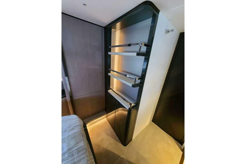 Slide: The Image of Luxurious interior shelving in 2023 Sunseeker Manhattan 68 yacht cabin. - 36