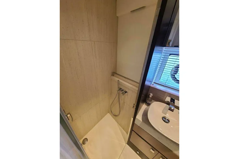 Slide: The Image of Modern bathroom in 2023 Sunseeker Manhattan 68 yacht with shower and sink. - 38