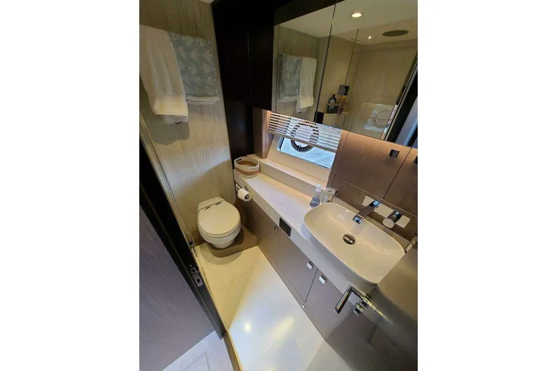 Slide: The Image of Luxurious bathroom in 2023 Sunseeker Manhattan 68 yacht, featuring modern fixtures and elegant design. - 39