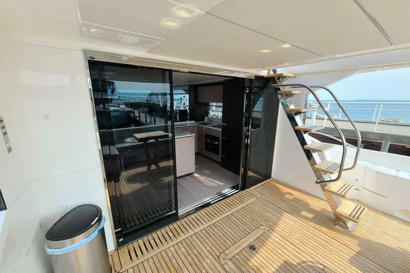 Slide: The Image of Luxury Sunseeker Manhattan 68 yacht interior with modern kitchen and sleek staircase, 2023 model. - 7