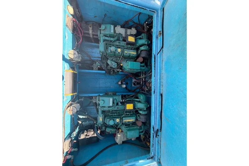 Slide: The Image of Twin engines in a blue Wilson 24 boat, model year 1976. - 7