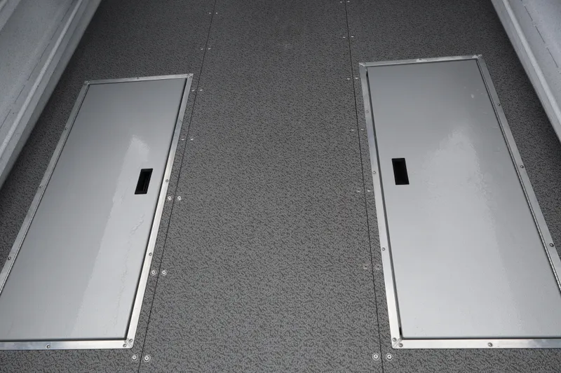 Slide: The Image of 2026 KingFisher 2825 Coastal Express boat deck with two storage hatches. - 10