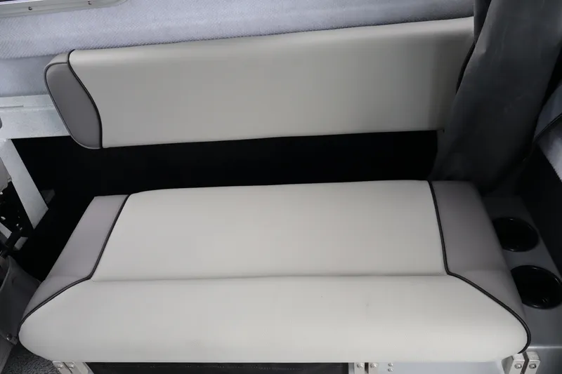 Slide: The Image of Interior seating of 2026 KingFisher 2825 Coastal Express boat, featuring sleek, cushioned design. - 14