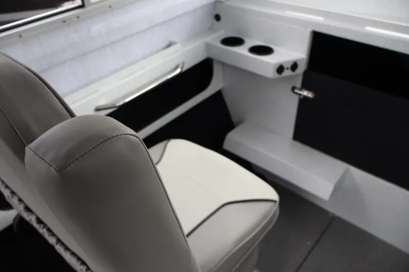 Slide: The Image of Interior of 2026 KingFisher 2825 Coastal Express boat with seating and cup holders. - 17