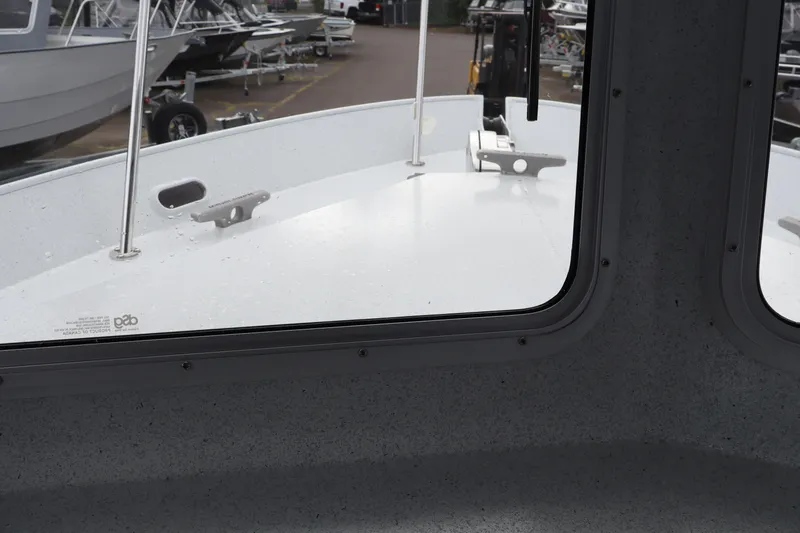 Slide: The Image of Interior view of 2026 KingFisher 2825 Coastal Express boat through window. - 19