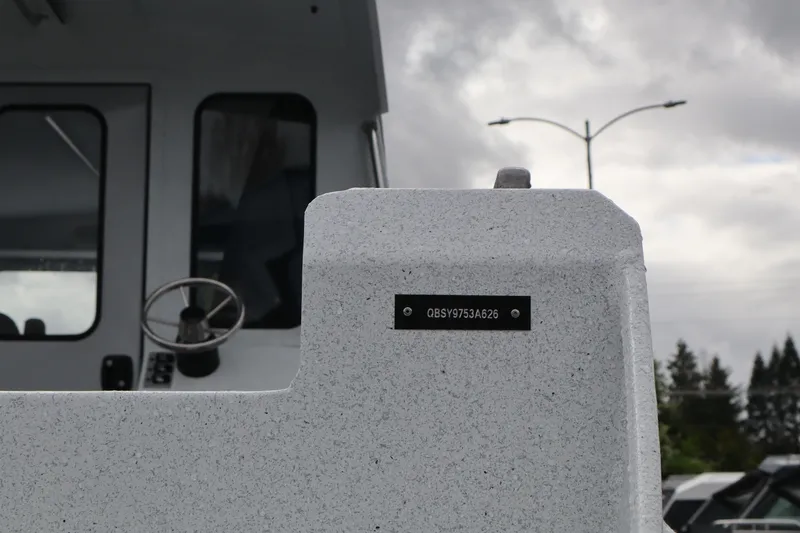 Slide: The Image of 2026 KingFisher 2825 Coastal Express boat with visible serial number plate. - 3