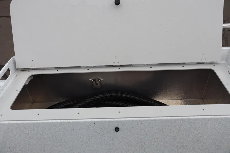 Slide: The Image of Open storage compartment on 2026 KingFisher 2825 Coastal Express boat. - 7