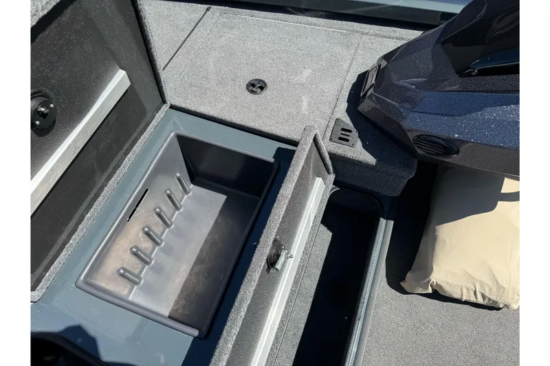 Slide: The Image of 2024 Ranger RT178 boat storage compartment with open lid, showcasing interior space. - 18