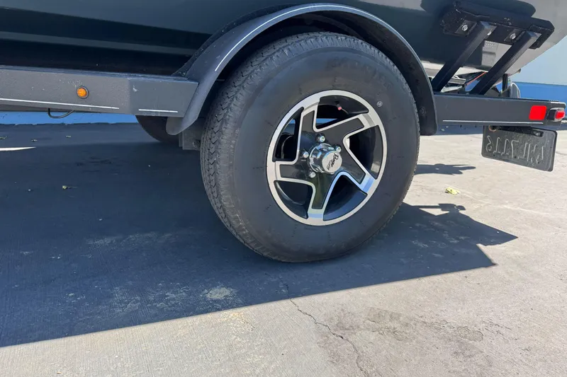 Slide: The Image of 2024 Ranger RT178 trailer wheel on pavement, showcasing tire and rim design. - 3