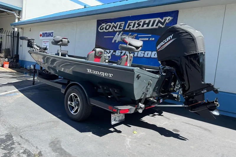 Slide: The Image of 2024 Ranger RT178 fishing boat with Mercury engine parked outside a store. - 4
