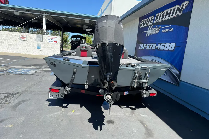 Slide: The Image of 2024 Ranger RT178 boat with outboard motor at dealership parking lot. - 5