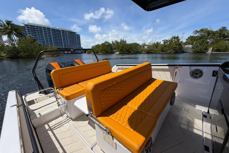 Slide: The Image of Luxury VIRTUE YACHTS V10 TOP 2026 with vibrant orange seating on a sunny day. - 10