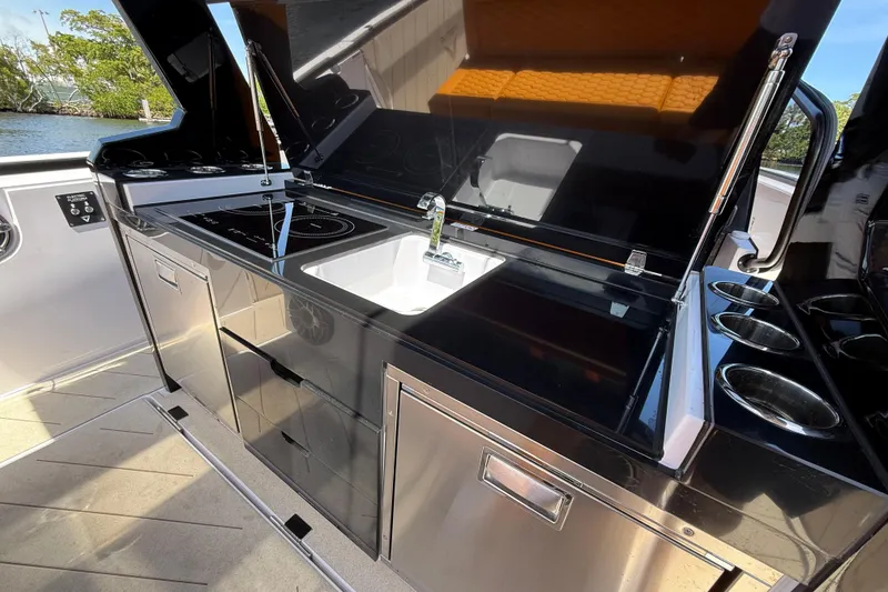 Slide: The Image of Modern kitchen area on 2026 VIRTUE YACHTS V10 TOP with sleek appliances and sink. - 11