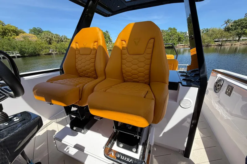 Slide: The Image of Luxury seating on 2026 VIRTUE YACHTS V10 TOP, featuring vibrant orange upholstery. - 12