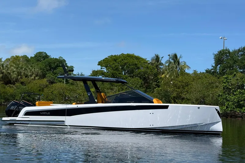Slide: The Image of Modern 2026 VIRTUE YACHTS V10 TOP on tranquil water, surrounded by lush greenery. - 4