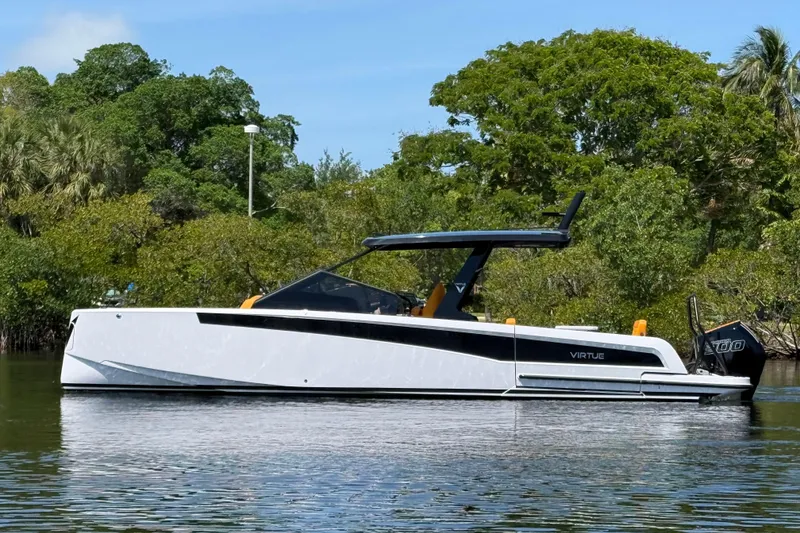 Slide: The Image of Modern 2026 VIRTUE YACHTS V10 TOP on calm water, surrounded by lush greenery. - 5