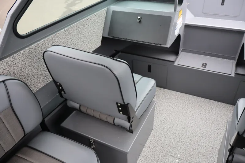 Slide: The Image of Interior of 2026 Alumaweld Stryker X202 boat with gray seating and storage compartments. - 12