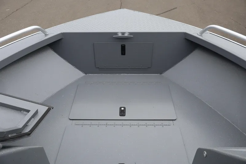 Slide: The Image of 2026 Alumaweld Stryker X202 boat interior with storage compartments and sleek design. - 14