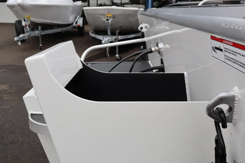 Slide: The Image of 2026 Alumaweld Stryker X202 boat detail, showcasing interior and warning label. - 17