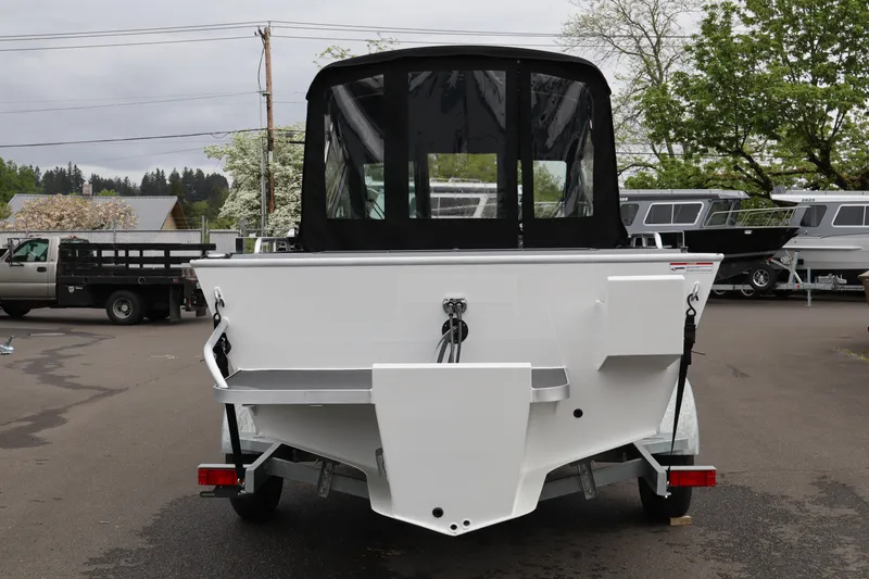 Slide: The Image of 2026 Alumaweld Stryker X202 boat on trailer, rear view in outdoor setting. - 4