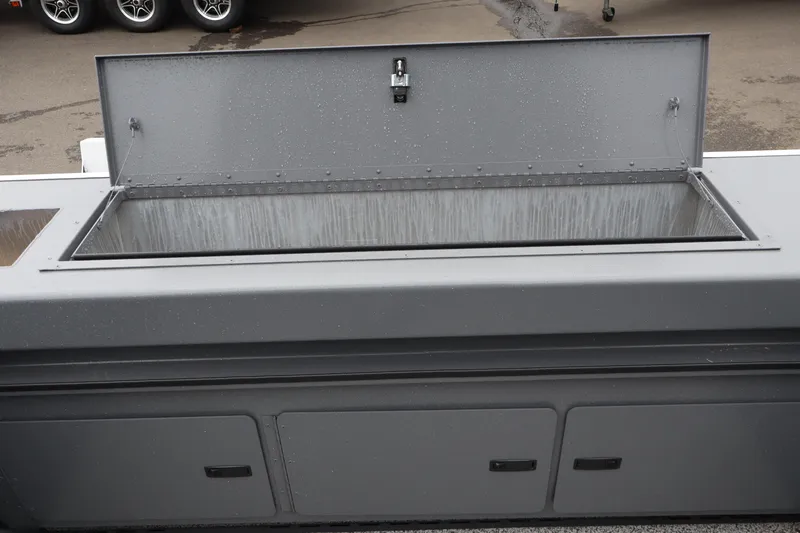 Slide: The Image of Open storage compartment on 2026 Alumaweld Stryker X202 boat, showcasing interior space. - 6