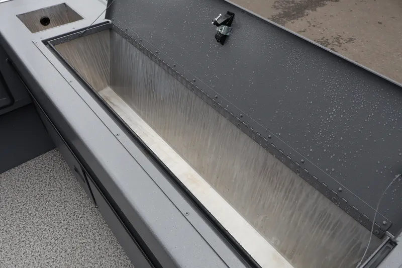 Slide: The Image of 2026 Alumaweld Stryker X202 boat interior with open storage compartment. - 7