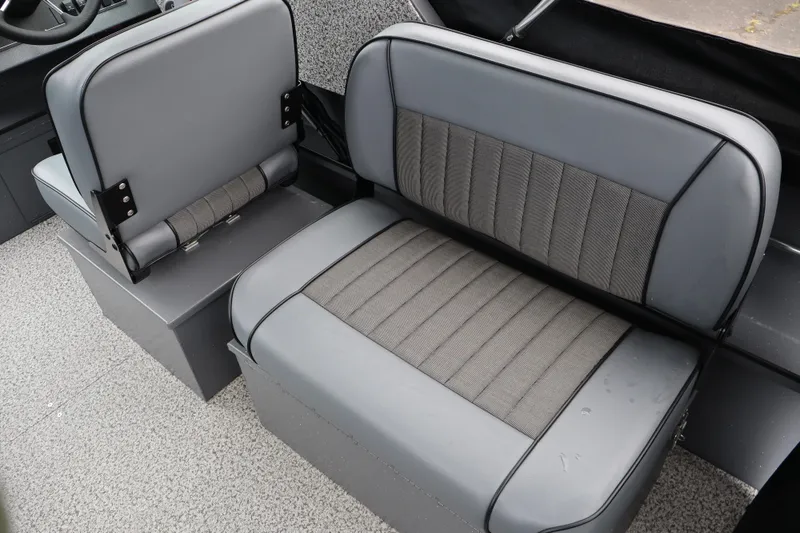 Slide: The Image of 2026 Alumaweld Stryker X202 boat interior with gray cushioned seating. - 9