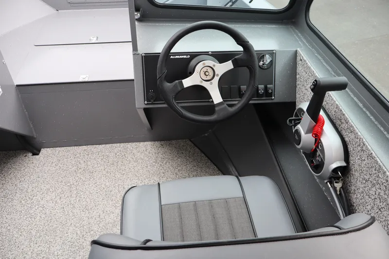 Slide: The Image of 2026 Alumaweld Talon 18 boat interior with steering wheel and control panel. - 11
