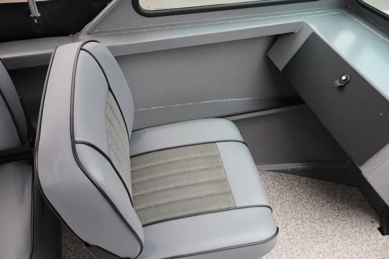 Slide: The Image of Interior seating of 2026 Alumaweld Talon 18 boat, featuring gray upholstery and sleek design. - 13